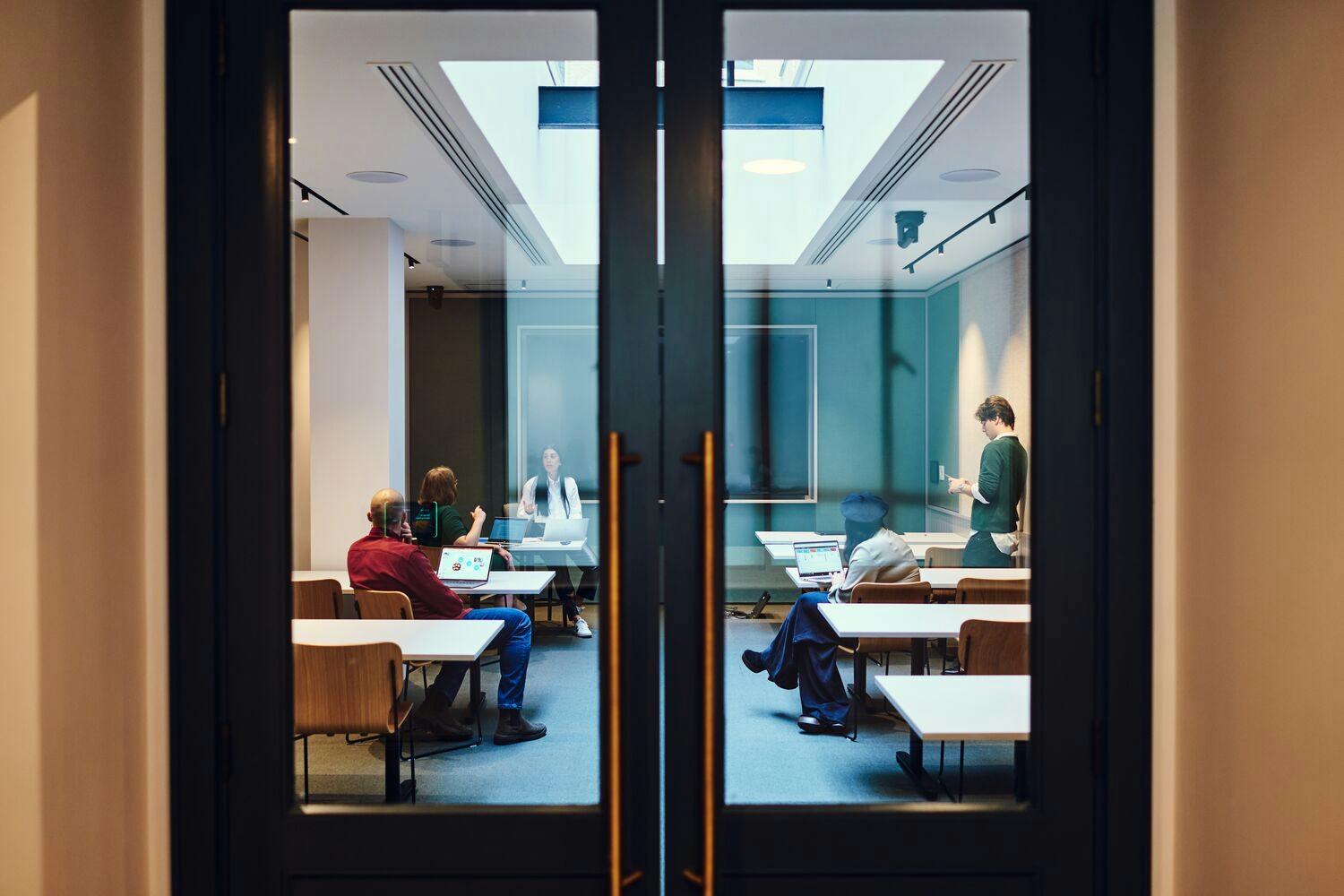 Modern meeting room at Salisbury House with attendees engaged in collaboration.