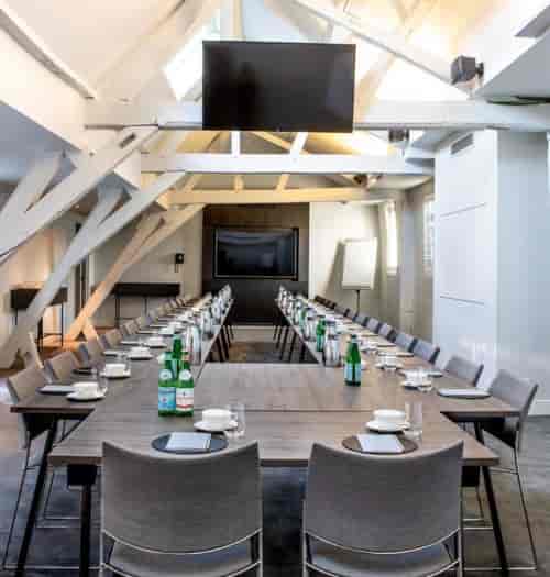 Meeting room at Pillows Grand Boutique Hotel with modern decor, ideal for workshops and meetings.