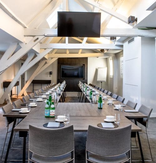 Meeting room at Pillows Grand Boutique Hotel with modern decor, ideal for workshops and meetings.