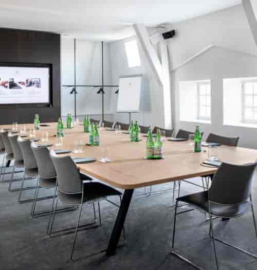 Modern meeting room at Pillows Grand Boutique Hotel, perfect for corporate events and workshops.