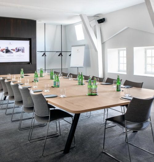 Modern meeting room at Pillows Grand Boutique Hotel, perfect for corporate events and workshops.