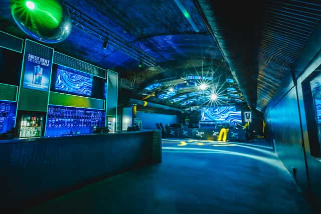 Fire Mirror Arch venue with dynamic lighting, ideal for parties and corporate events.