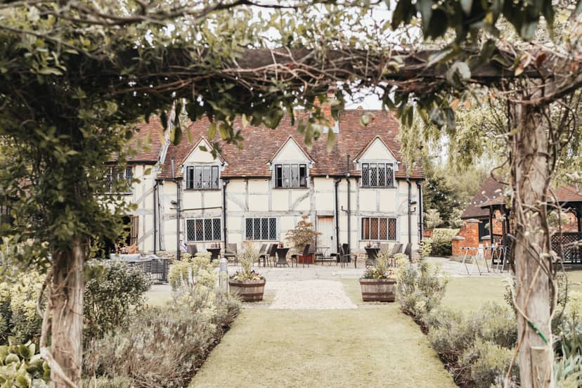 Charming Botley Hill Barn venue with lush garden for outdoor weddings and events.