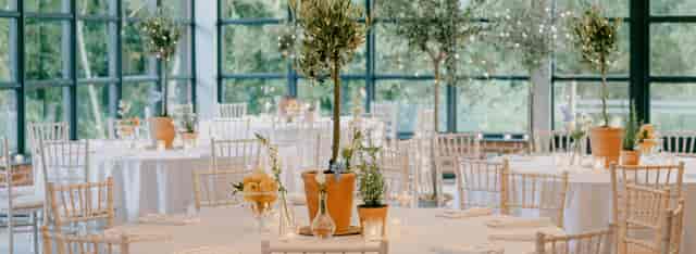 Elegant barn wedding setup with round tables and rustic decor at Botley Hill Barn.