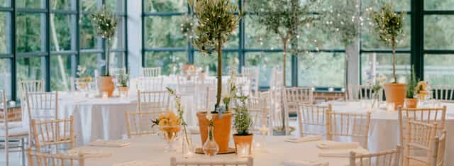 Elegant barn wedding setup with round tables and rustic decor at Botley Hill Barn.