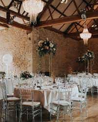 Elegant barn wedding setup with floral centerpieces at Botley Hill Barn.