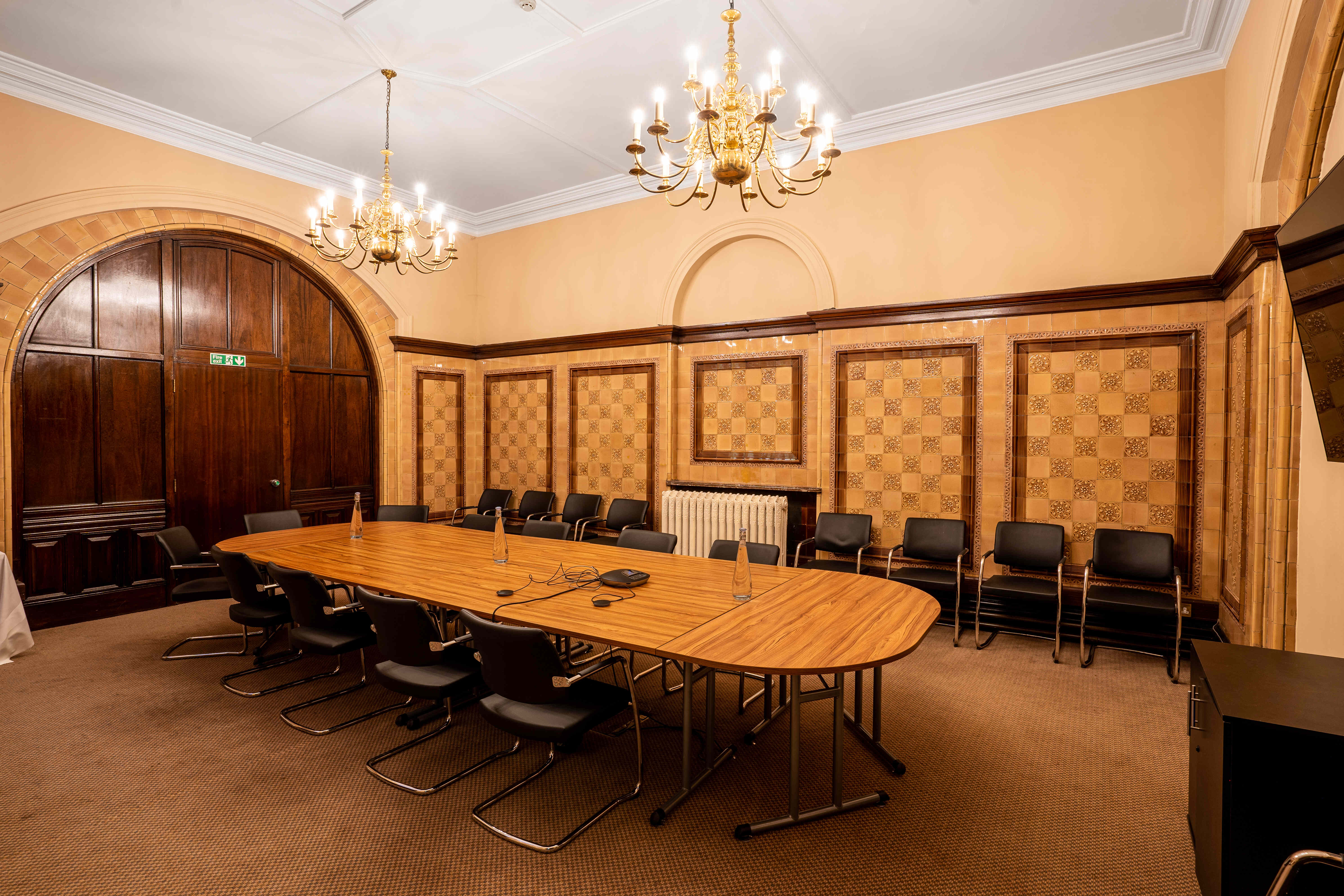 Naoroji Room at National Liberal Club, elegant meeting space with oval table, ideal for conferences. - Banner