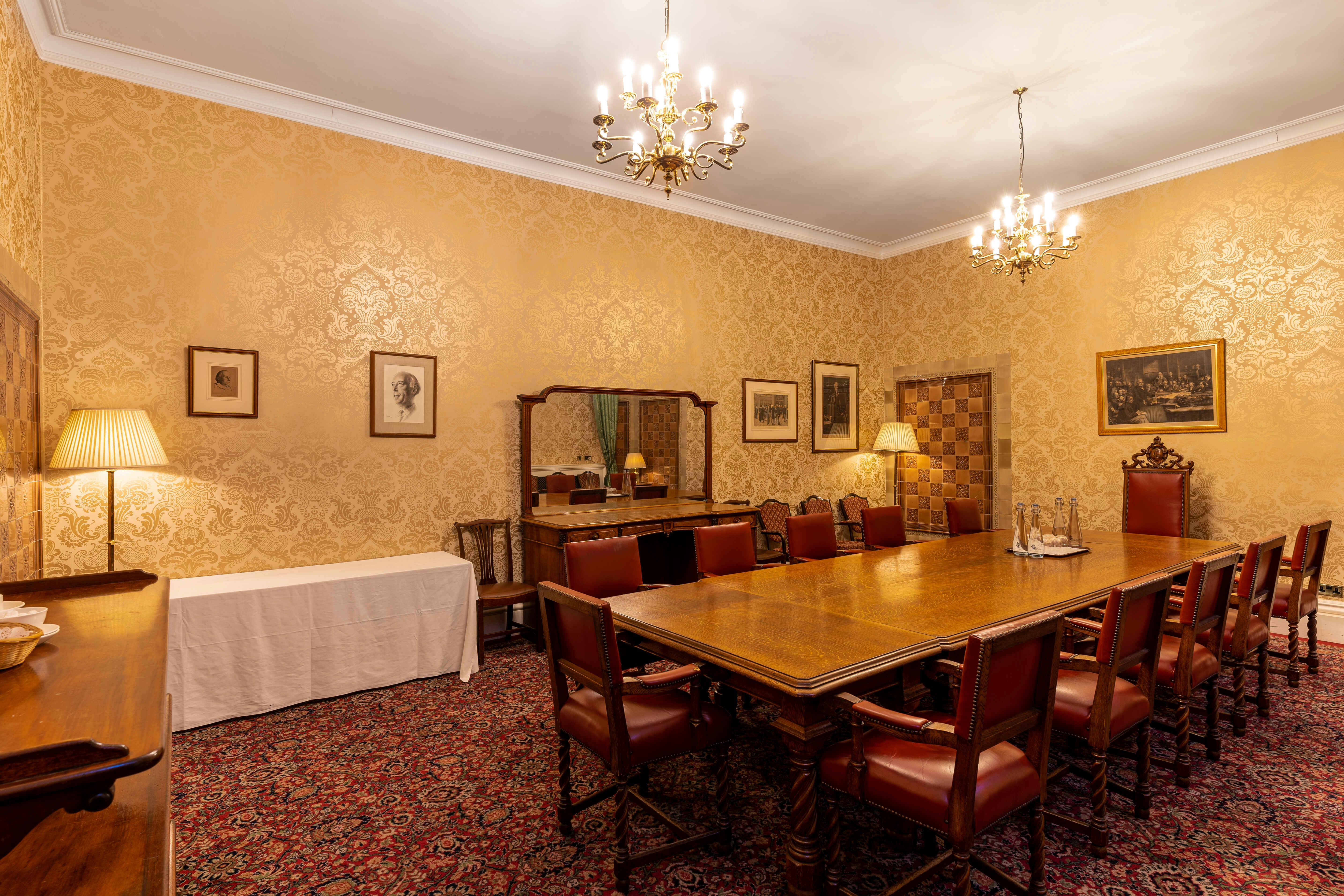 Lawrence Robson Room: elegant meeting space with leather chairs for executive gatherings.