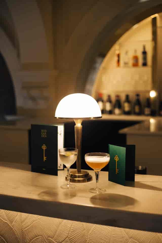 Stylish bar with elegant cocktails in The Hidden Garden for networking events.
