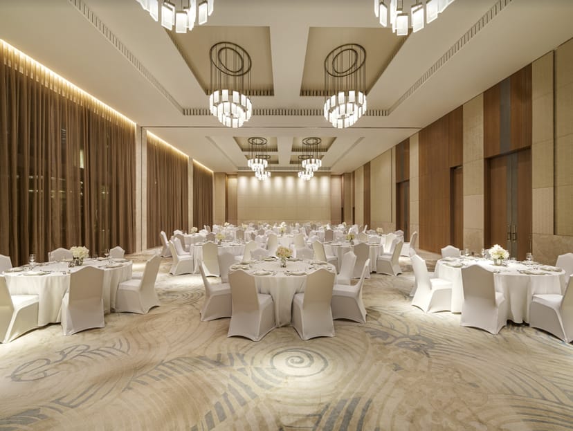 Elegant ballroom with round tables, perfect for weddings and corporate events.