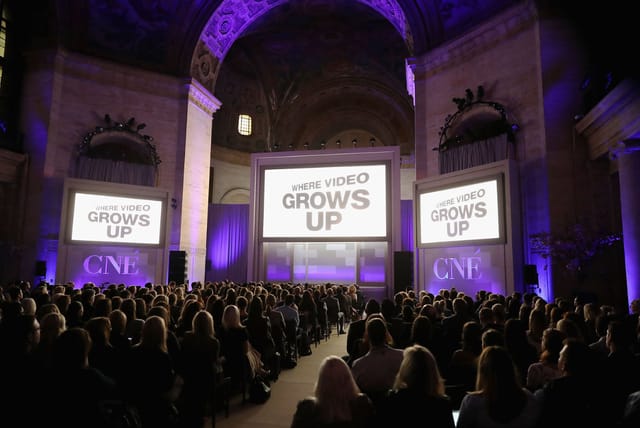 Elegant Cipriani 25 Broadway ballroom hosting a conference with large screen display.