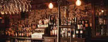 Stylish bar setup with vintage decor, perfect for networking events and cocktail receptions.