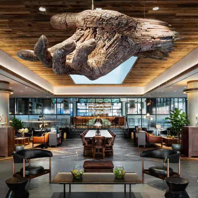 Maven Bar with artistic hand sculpture, perfect for meetings and networking events.