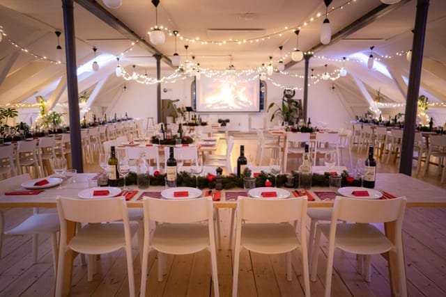 Elegant event space with table settings, ideal for corporate dinners and celebrations.