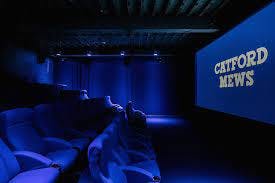 Modern cinema screen at Catford Mews, ideal for private screenings and events.