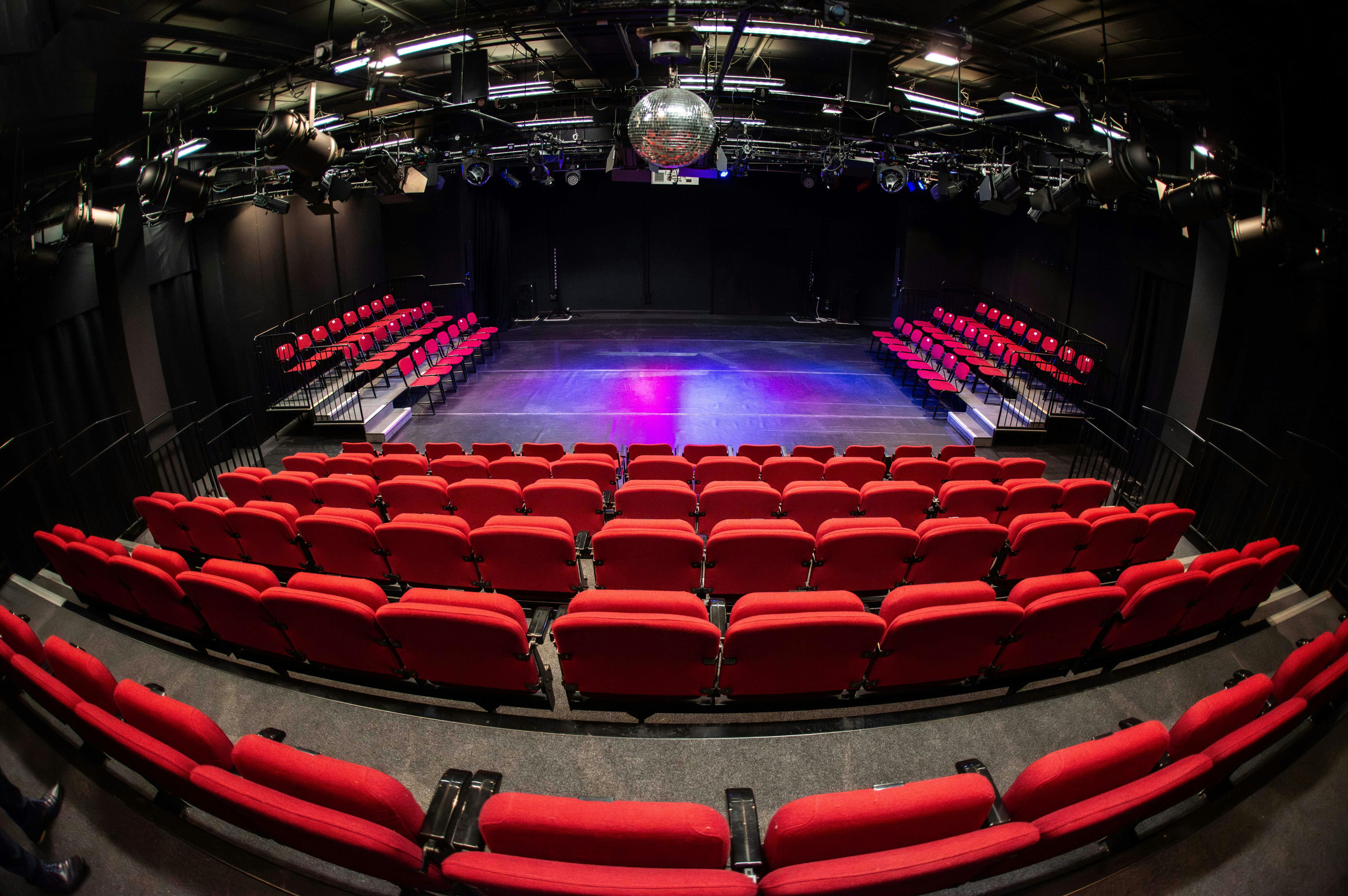 Dugdale Studio Theatre with tiered red seating for performances and events.