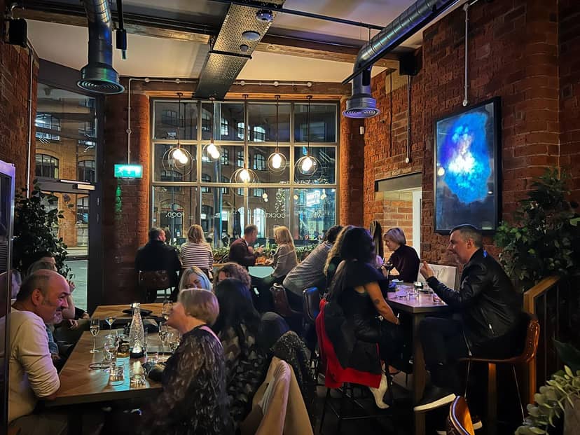 Vibrant dining venue with exposed brick, ideal for networking events and private dinners.