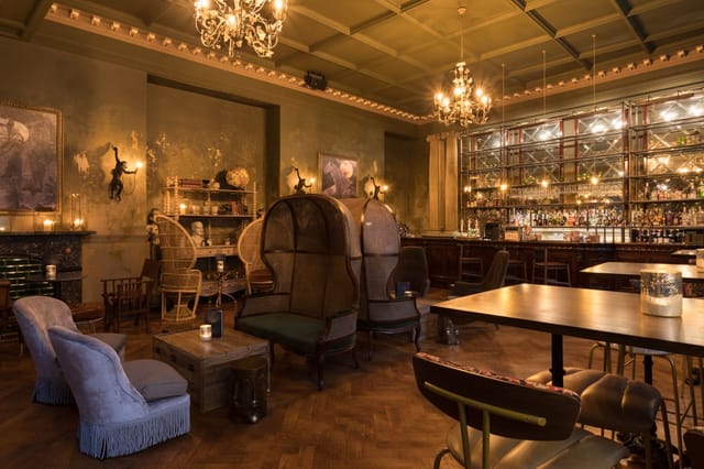 Stylish Secret Bar with plush seating, ideal for upscale meetings and cocktail receptions.