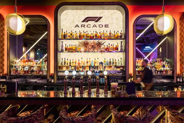 Vibrant F1 Arcade bar area, perfect for upscale events and networking in Birmingham.