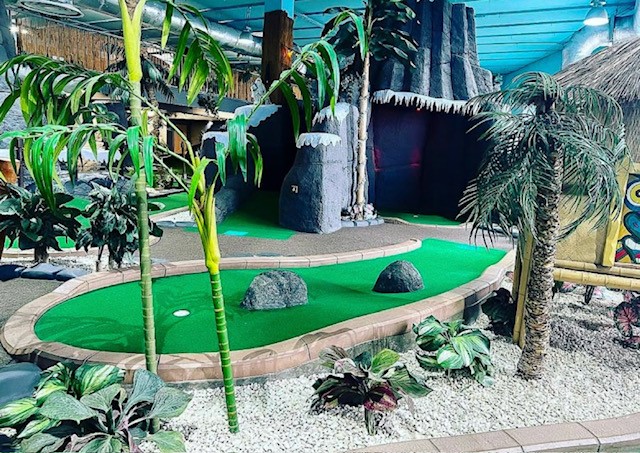 Vibrant mini-golf course in Jungle Rumble Birmingham for corporate outings and family events.