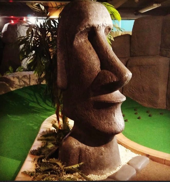 Moai statue at Jungle Rumble Birmingham for tropical adventure-themed events.