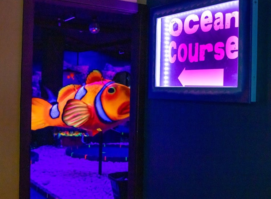 Ocean Course entrance at Jungle Rumble, vibrant decor for team-building events.