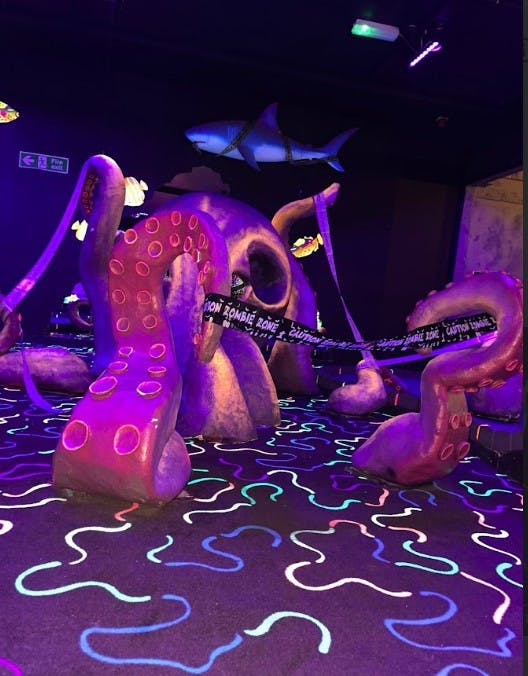 Vibrant Ocean Course with oversized octopus tentacles for themed events and marketing.