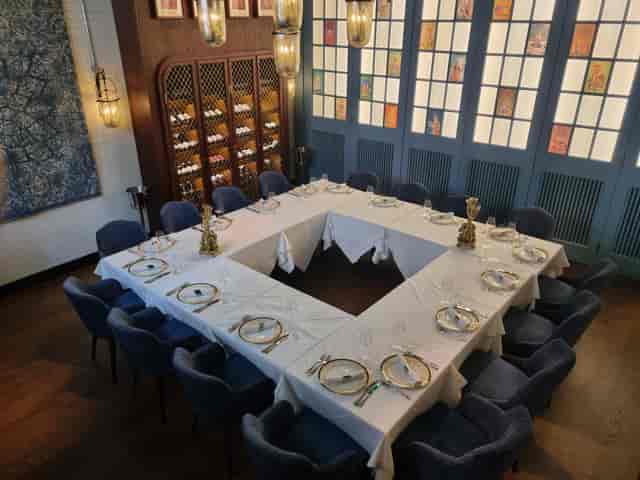 Elegant dining setup in Yaatra Restaurant for corporate meetings and private events.