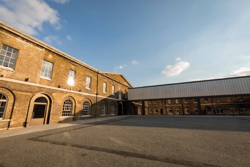 Versatile event space in Woolwich Works with large windows for meetings and gatherings.