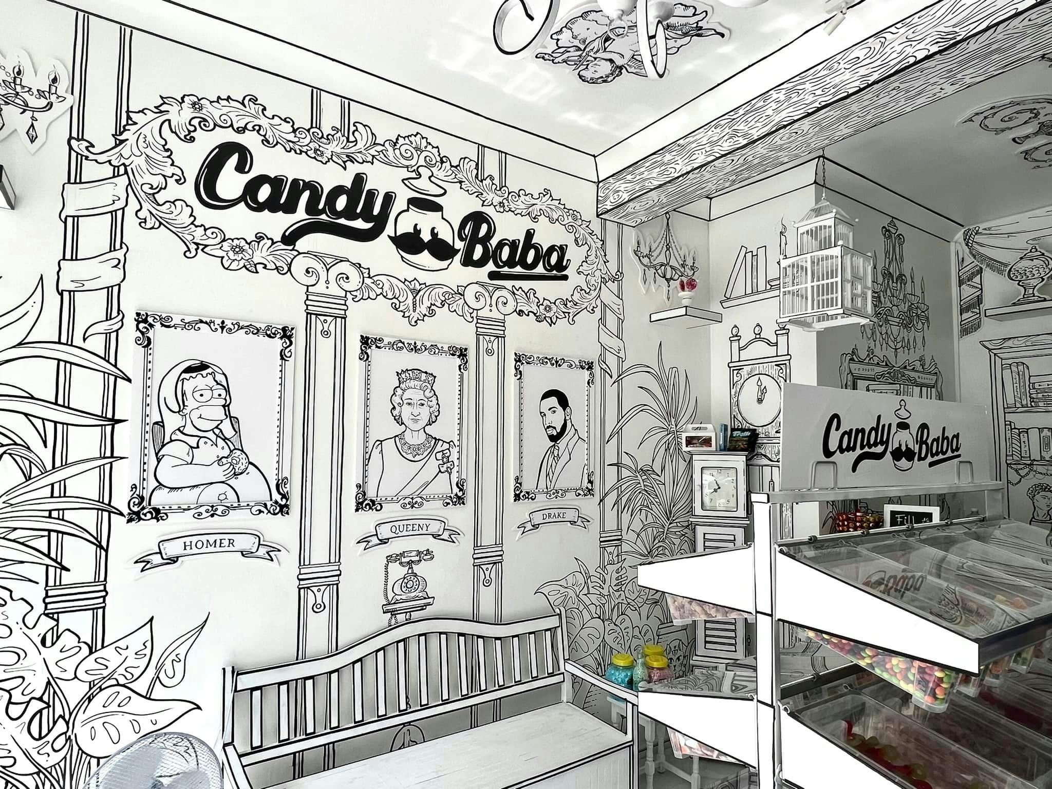 Whimsical candy shop interior with mural, ideal for themed events and gatherings.