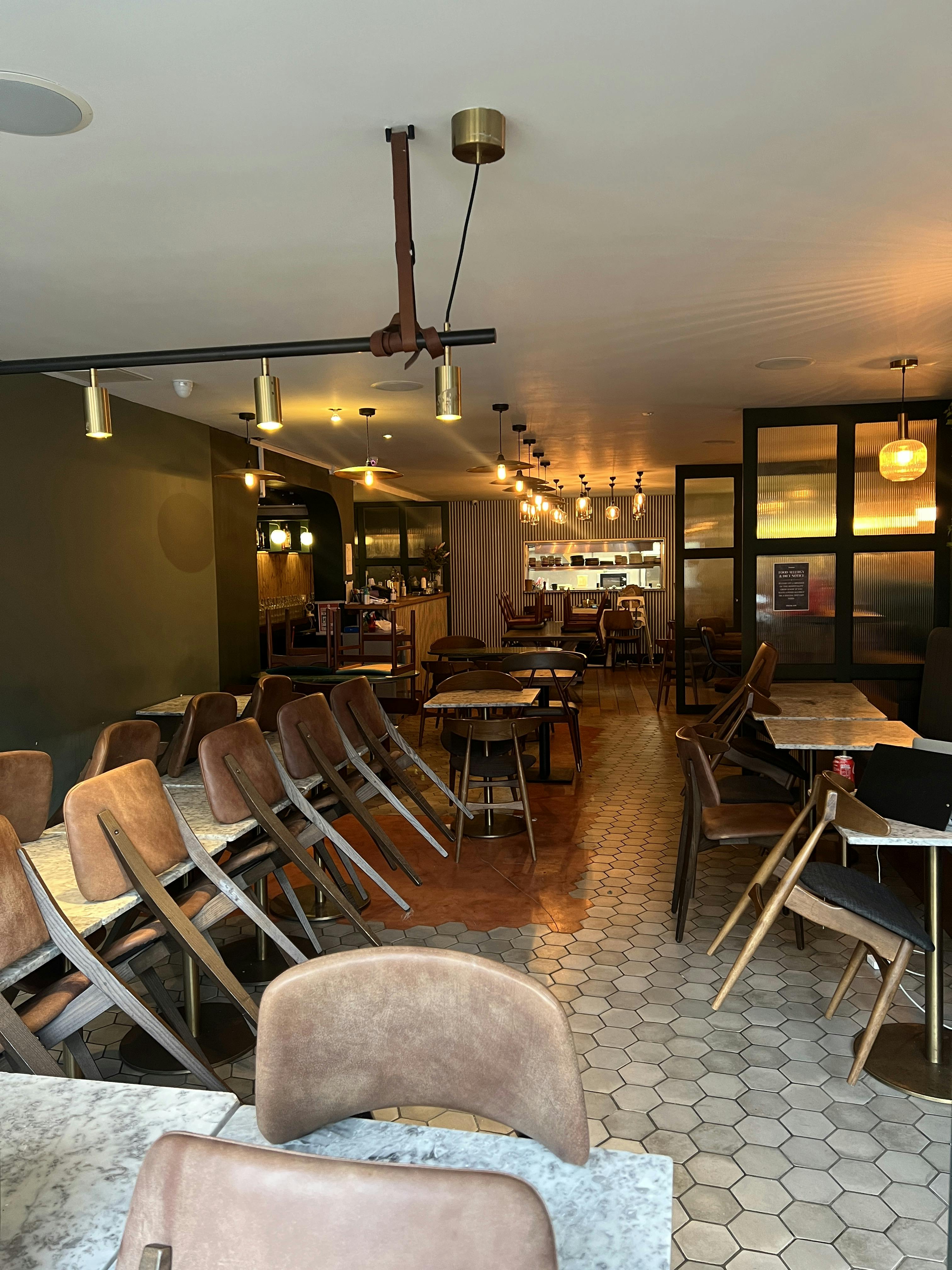 Versatile event space with warm lighting, ideal for gatherings and networking events.