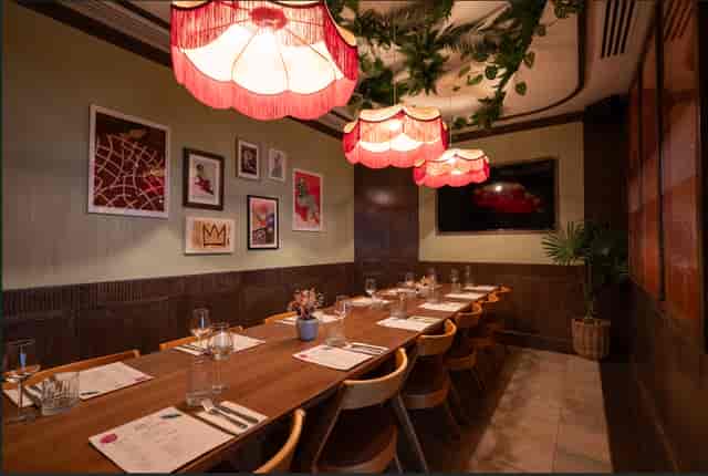 Private dining room with warm lighting, ideal for intimate meetings and events.