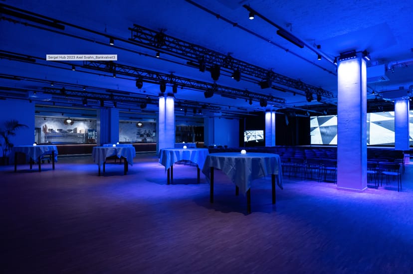 Modern event space in Sergel Hub with ambient blue lighting for corporate gatherings.