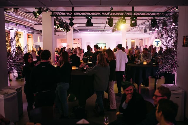 Vibrant networking event at Forum in Sergel Hub with elegant decor and high-top tables.