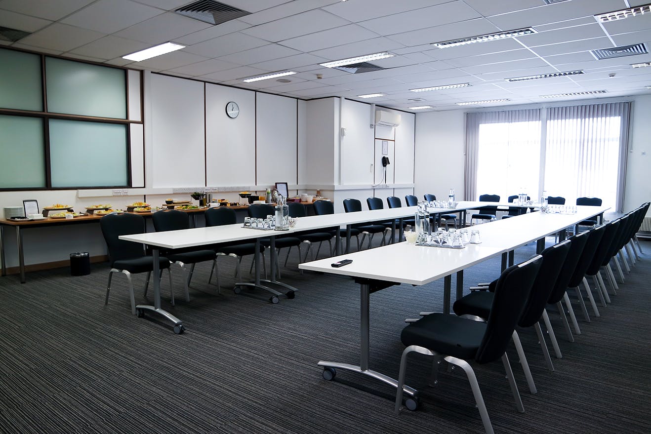 Dame Deirdre Hine Room U-shaped meeting setup for professional events and networking.