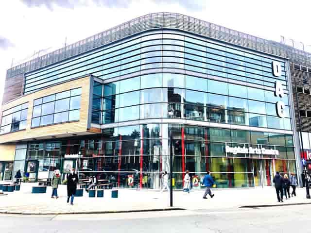 Modern event venue with sleek glass facade at Dugdale Arts Centre, ideal for conferences.