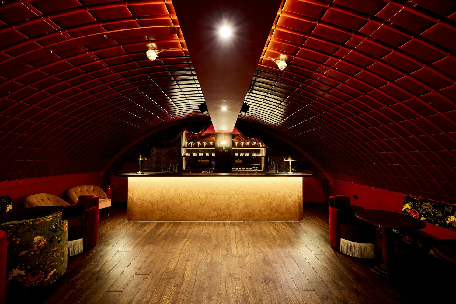 Stylish venue with curved ceiling, ideal for networking events and private parties.