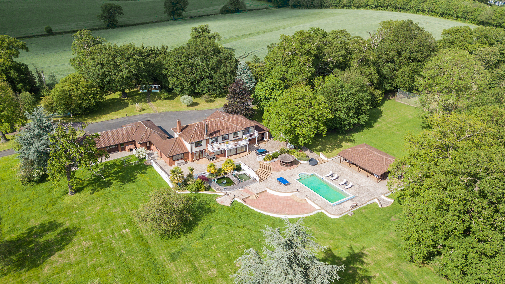 Villa Mansion outdoor venue with lush greenery, ideal for weddings and corporate events.