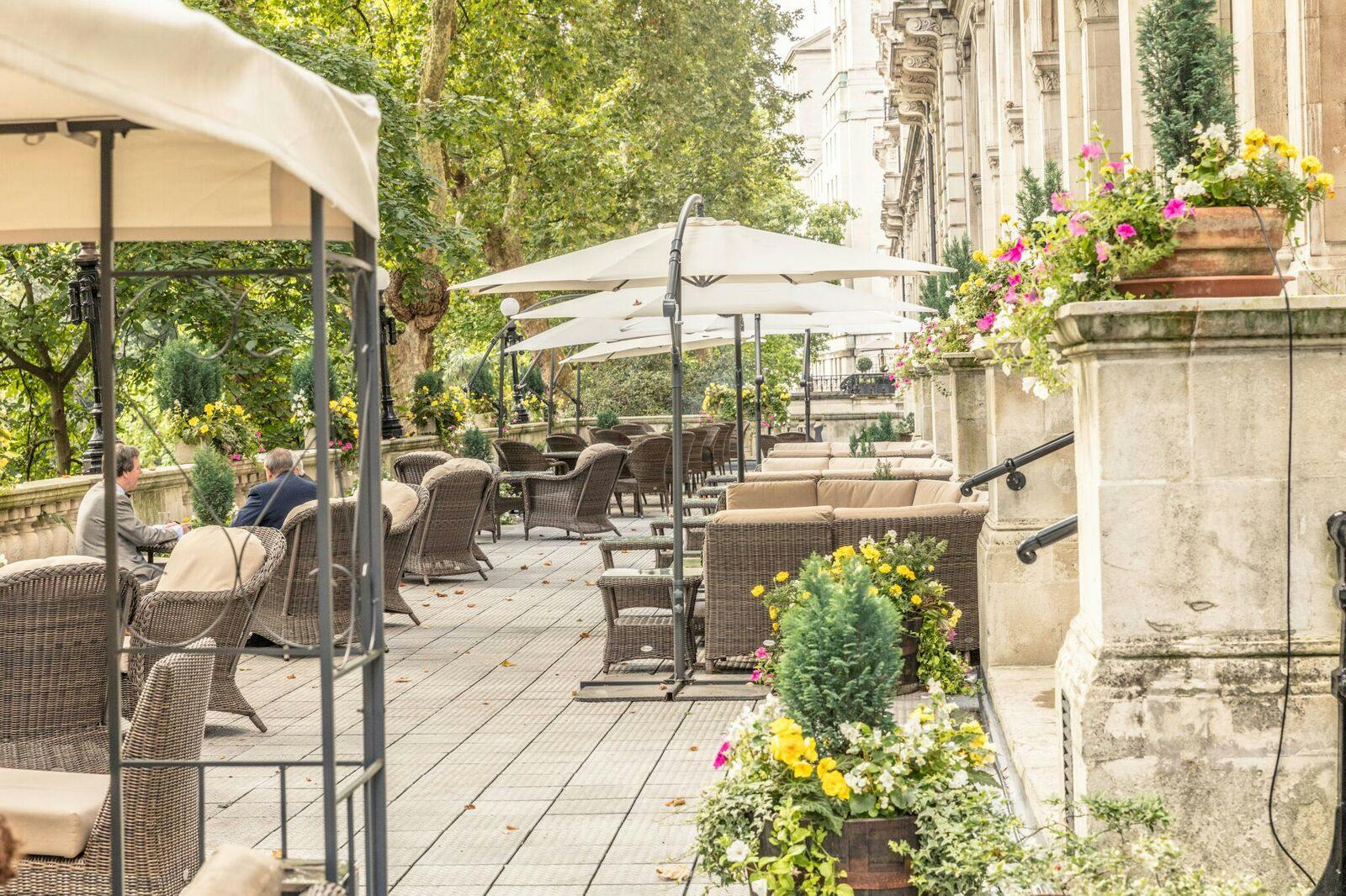 Charming outdoor event space at The National Liberal Club with elegant seating and greenery.