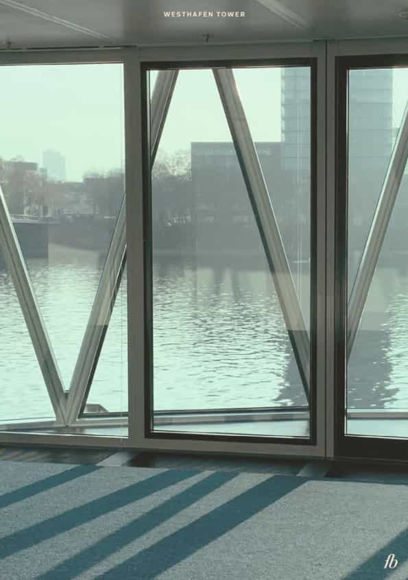 Westhafen Tower in Frankfurt: modern venue with glass windows for events and networking.