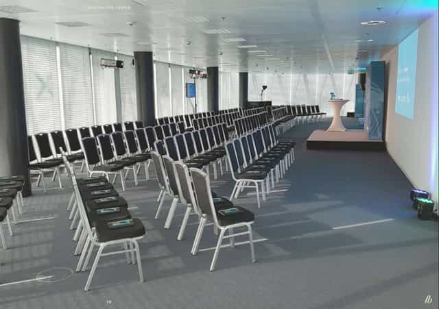 Westhafen Tower meeting space with podium, ideal for presentations and events.