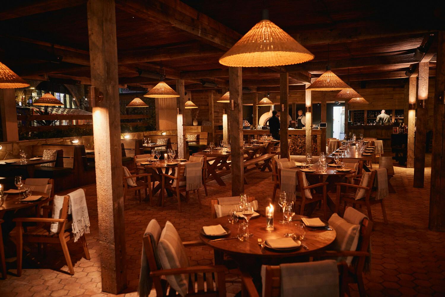 Elegant restaurant setting with warm lighting, ideal for corporate dinners and intimate gatherings.