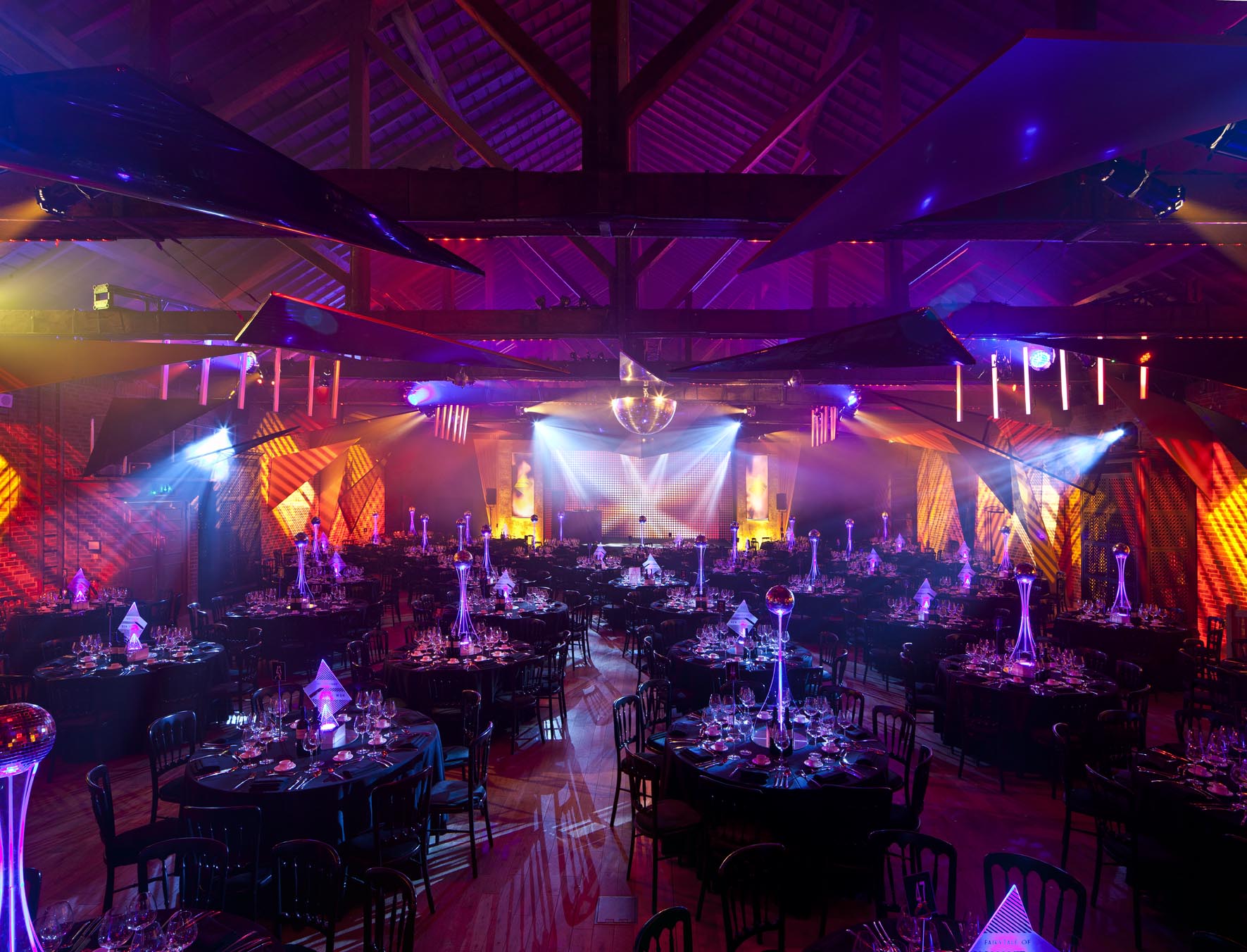 Elegant Christmas party setup with black linens at The Brewery, perfect for corporate events. - Banner