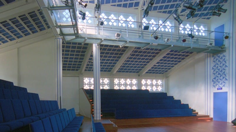 Spacious auditorium with tiered seating for presentations and workshops at Podium Mozaiek.