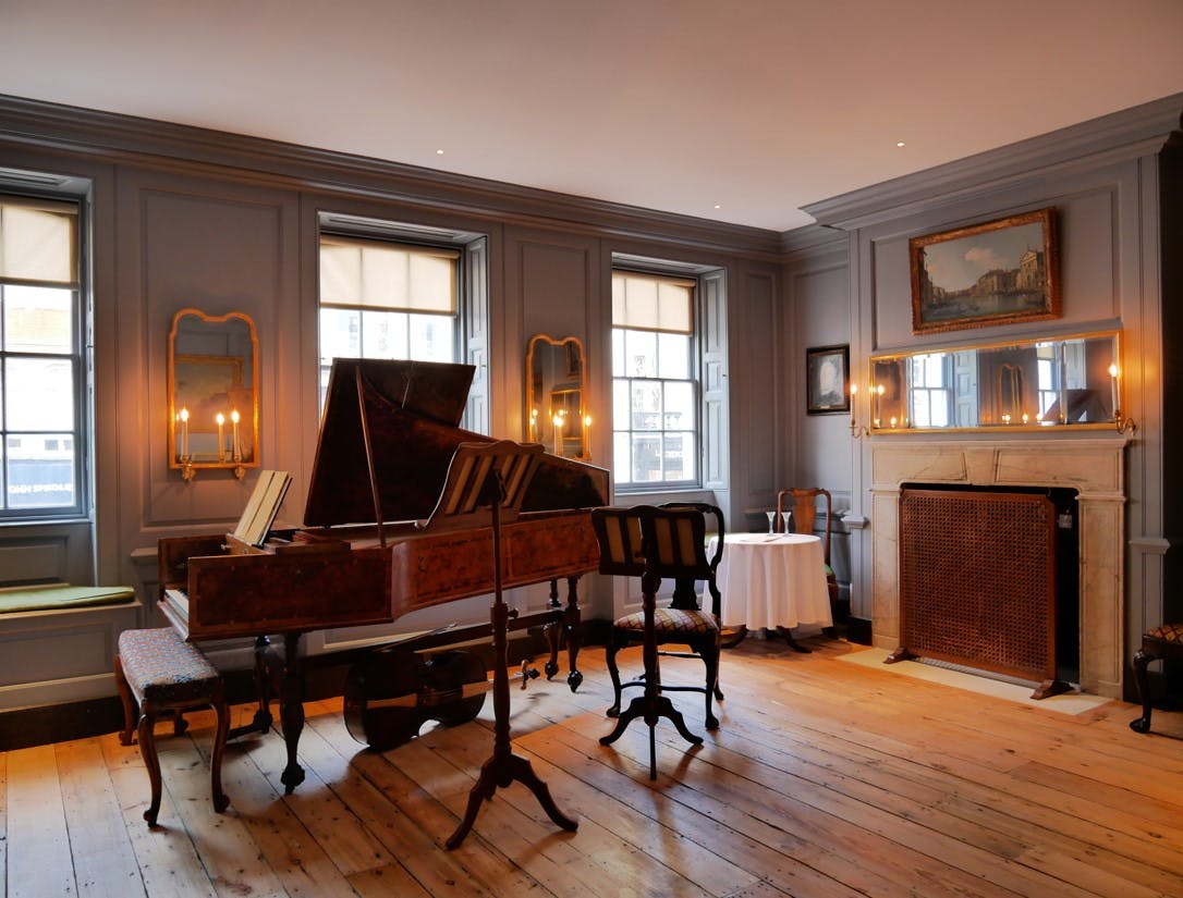 Elegant room with grand piano for intimate events at Handel Hendrix House.