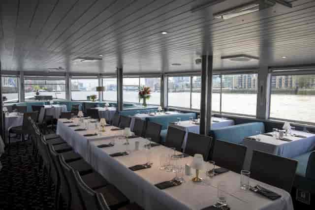 Elegant dining area on City Cruises boat for corporate events and private gatherings.