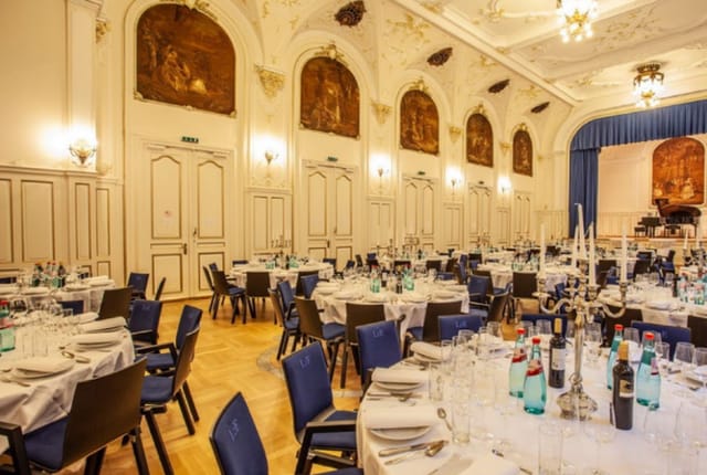 Elegant ballroom with round tables, perfect for weddings and corporate events.