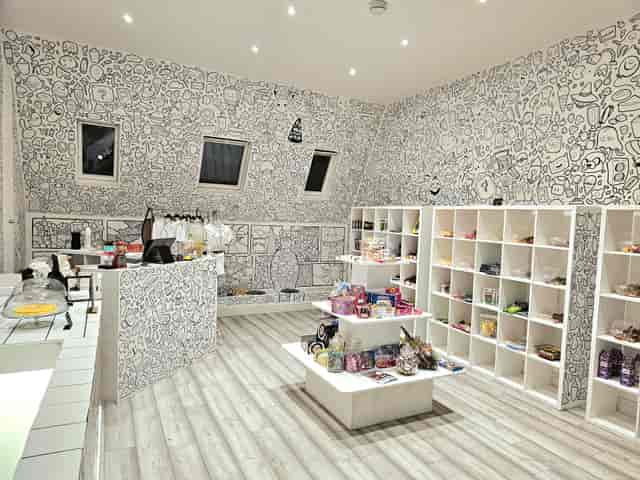 Whimsical event space with hand-drawn art, ideal for pop-up shows and themed gatherings.