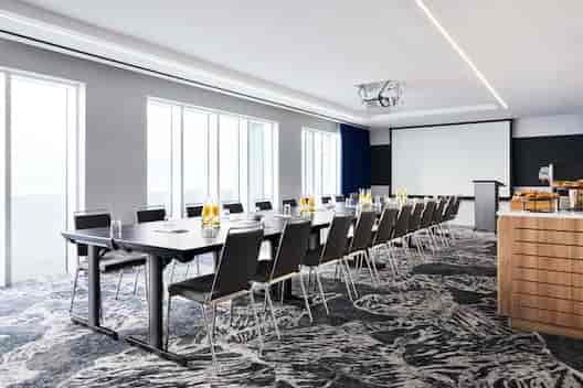 Modern meeting room in Hyatt Regency Stratford, ideal for corporate events and workshops.
