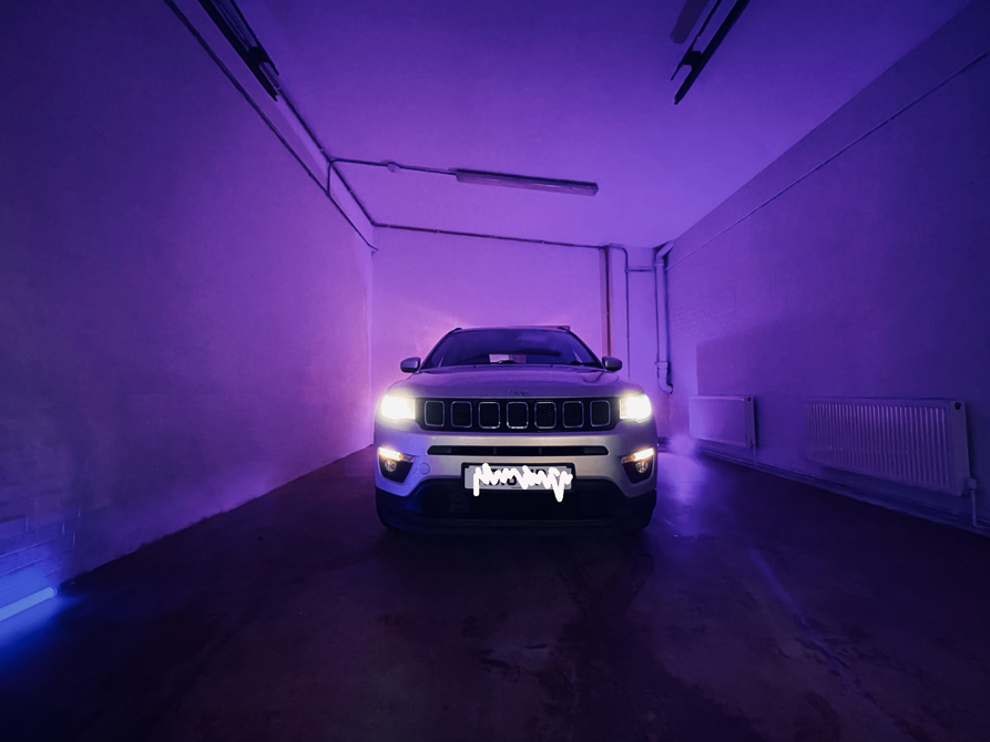 Sleek vehicle in purple-lit Studio 2, perfect for product launches and VIP events. - Banner